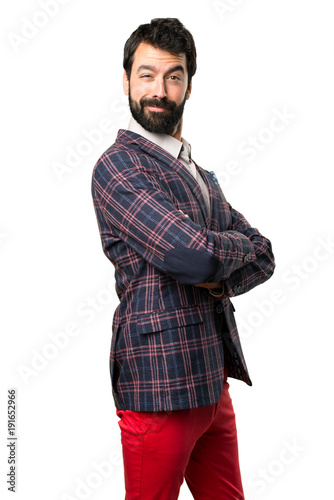 Well dressed man with his arms crossed on white background