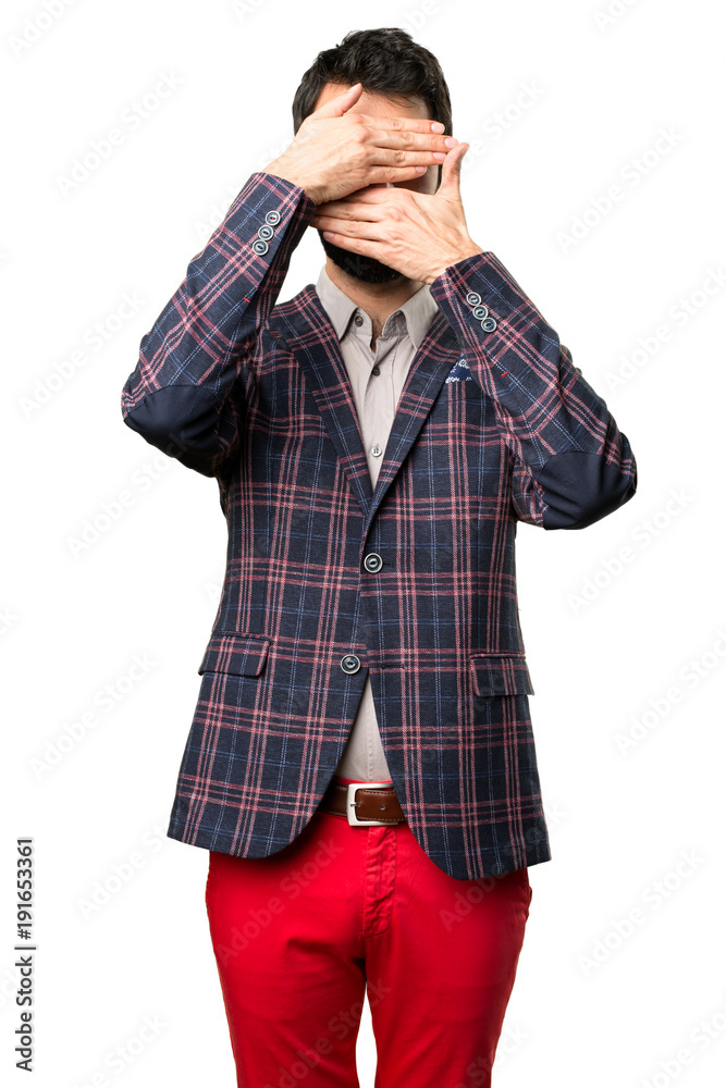 Well dressed man covering his face on white background Well dressed man covering his face on white background
