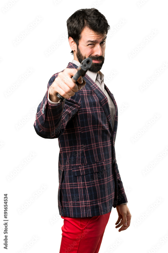 Well dressed man shooting with a pistol on white background Well dressed man shooting with a pistol on white background