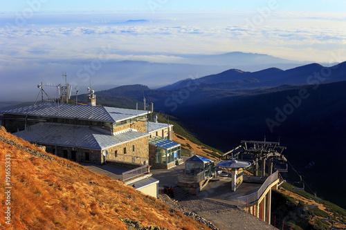 Fototapeta Naklejka Na Ścianę i Meble -  Zakopane, Tatra Mountains / Poland - 2010/07/04: Upper station of the Cable Railway on top of the Kasprowy Wierch peak with Low Tatras and Beskidy Mountains in background