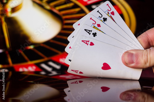 Full house poker cards combination on blurred background casino luck fortune card game