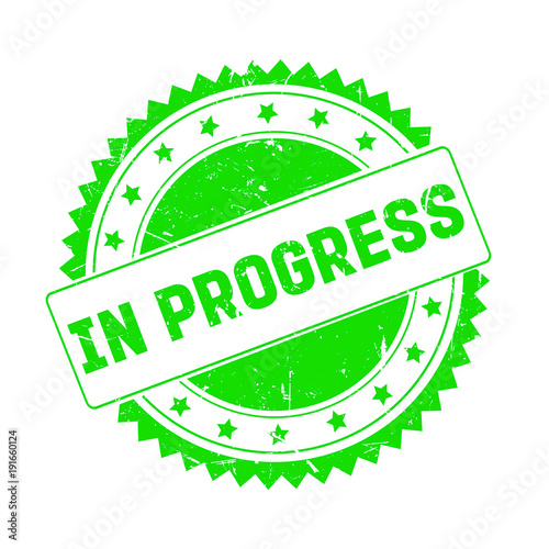 In Progress green grunge stamp isolated