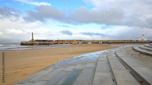 The beach at low tide by stormy and windy weather with Margate Harbor Arm in the background, Margate, Kent, UK © Christophe Cappelli