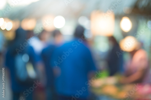abstract blur image of food stall at night festival with bokeh for background usage © nortongo