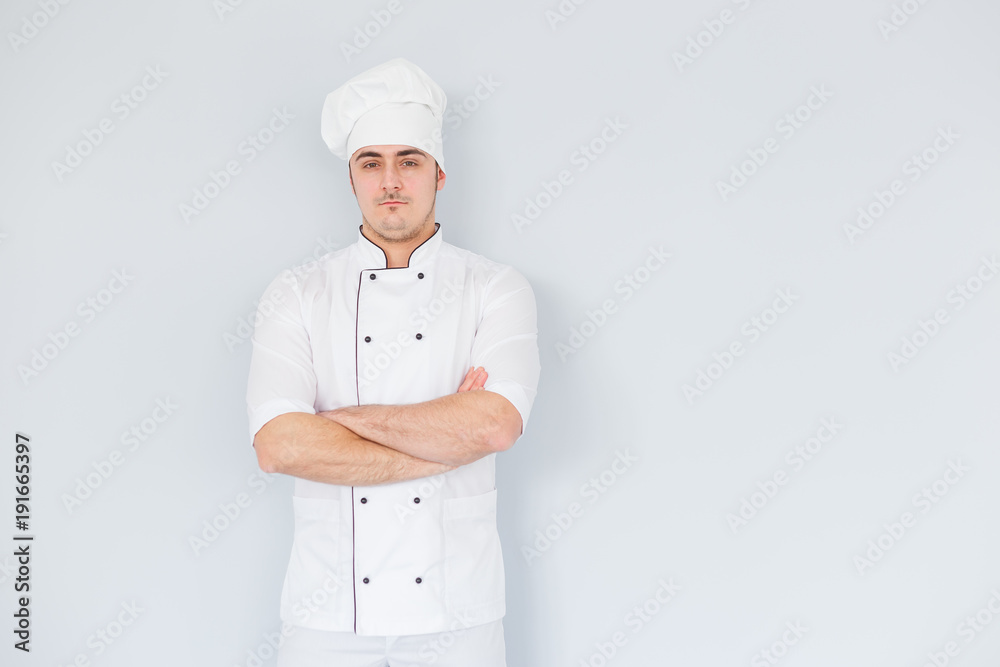 Pleased chef looking confidently at the camera. Professional approach to business
