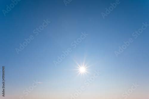low winter sparkle sun on a blue sky background