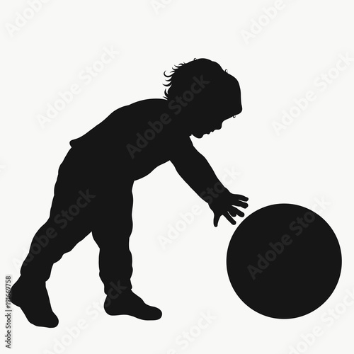 Little boy playing with a ball, silhouette