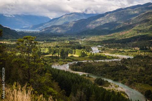 Landscape of Blue river, valley and forest in El Bolson, argentinian Patagonia photo