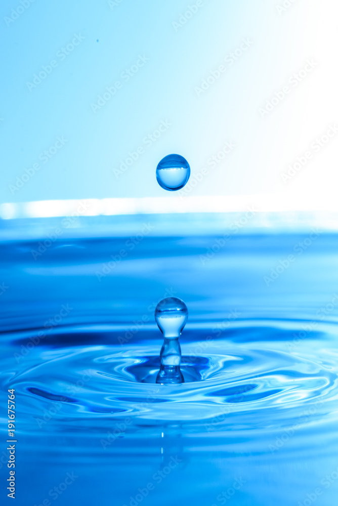 Water drop fall into water natural background. Pure health concept Water drop fall into water natural background. Pure health concept