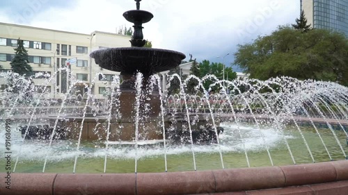 summer fountain in the center of city photo