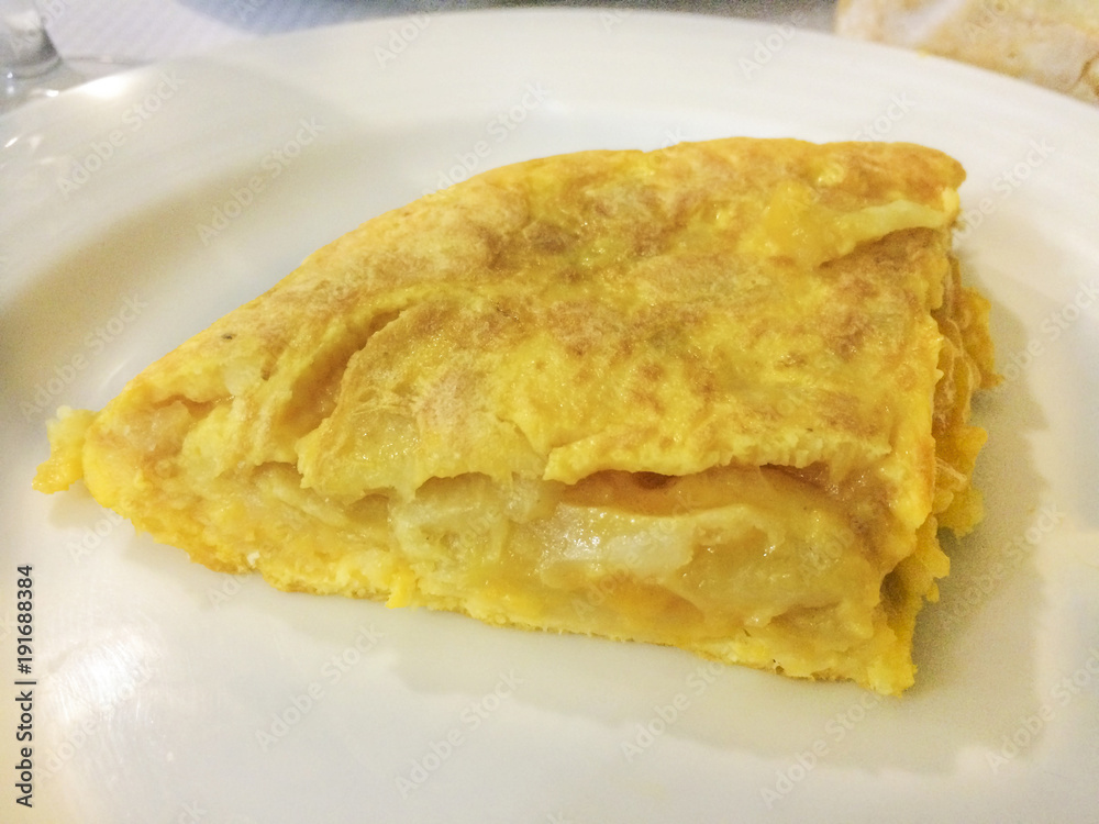 Portion of spanish omelet in the plate Portion of spanish omelet in the plate