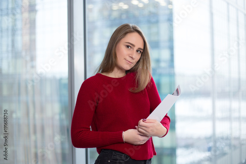 Free Download business girl at the window with papers reading. joy in solutions. signing the agreement and agreeing with partners  - GFXLoad