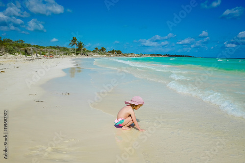 Sticker Child playing on a caribbean beach