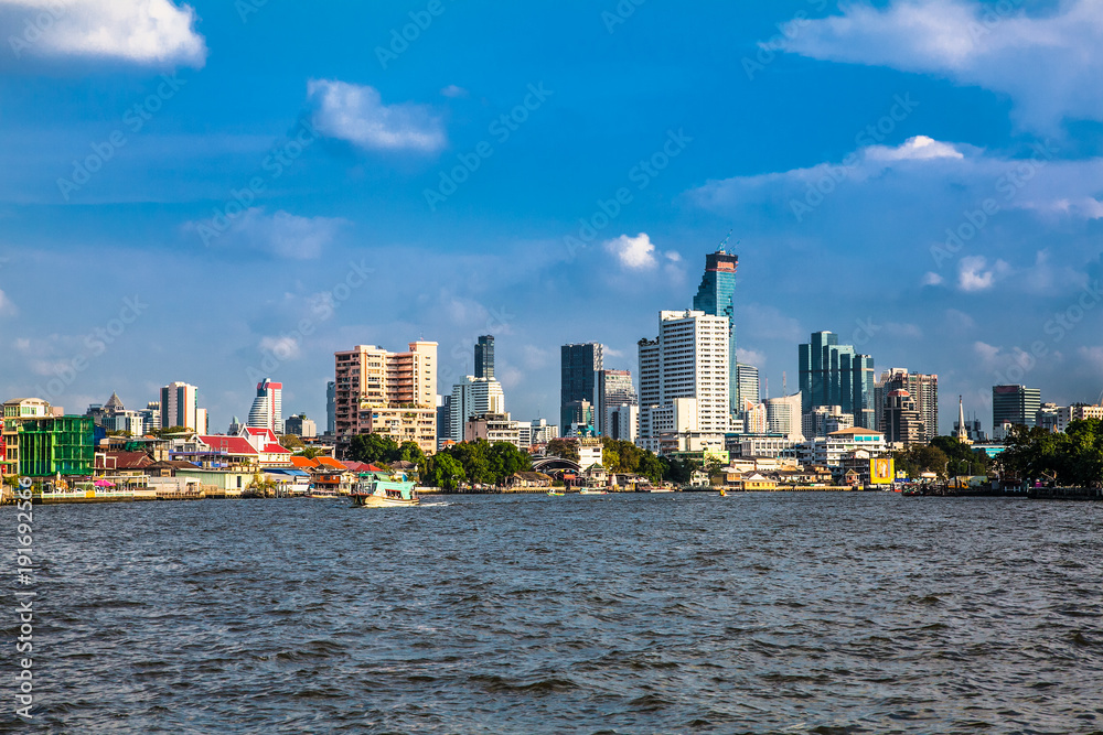 Business district cityscape from Jaopraya river in Bangkok