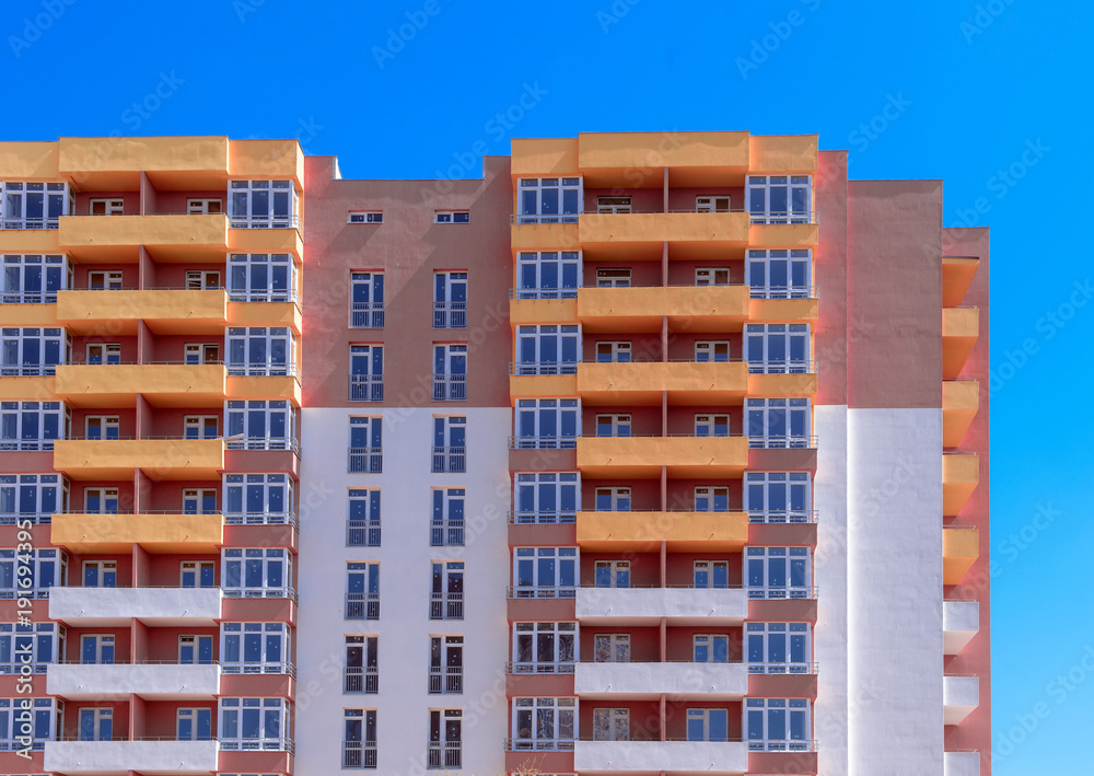 apartment building construction site on blue sky background