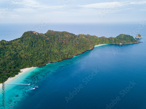 Aerial view from a drone of beautiful Nyaung Oo Phee island on sunny day in Myanmar.