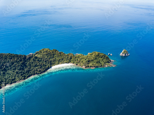 Aerial view from a drone of beautiful Nyaung Oo Phee island on sunny day in Myanmar.