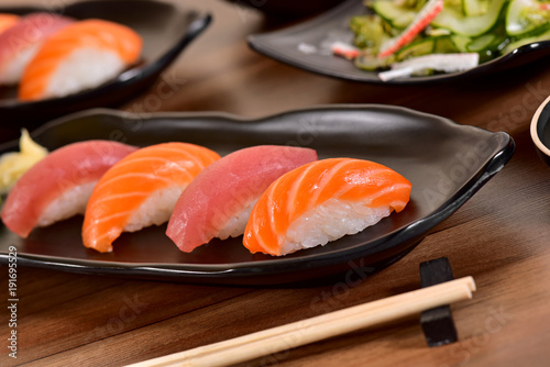 Salmon and Tuna Nigiri Sushis on restaurant table