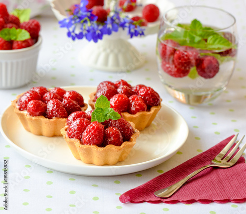 Mini tarts with raspberries fruits