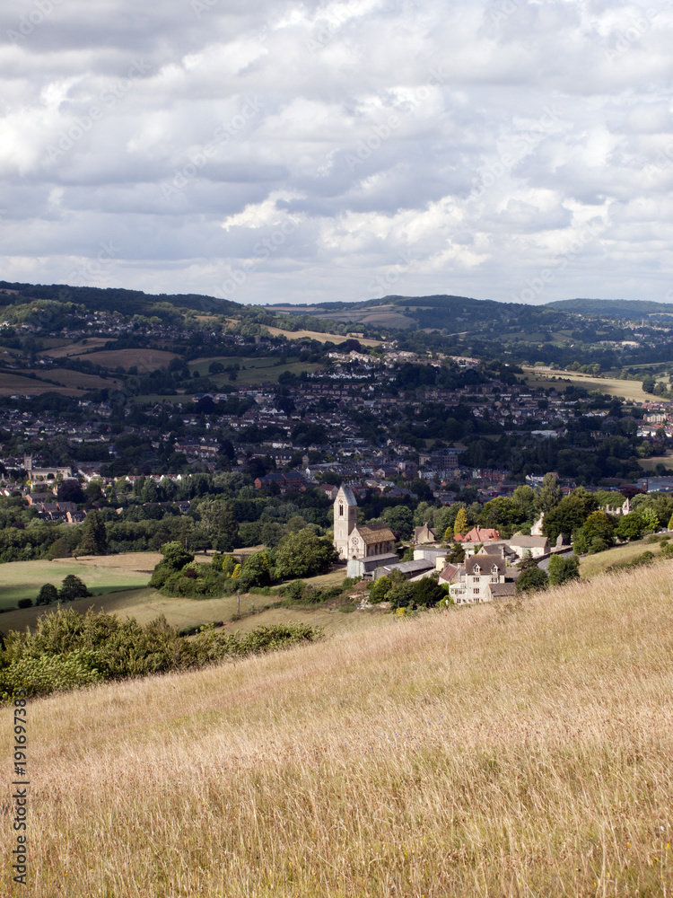 View over Selsey village and church to Stroud on the edge of the Cotswold Hills, Gloucestershire, UK