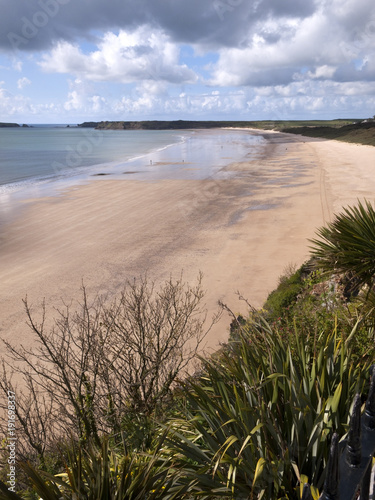 An almost empty South Beach in early spring sunshine  Tenby  Pembrokeshire  Wales  UK