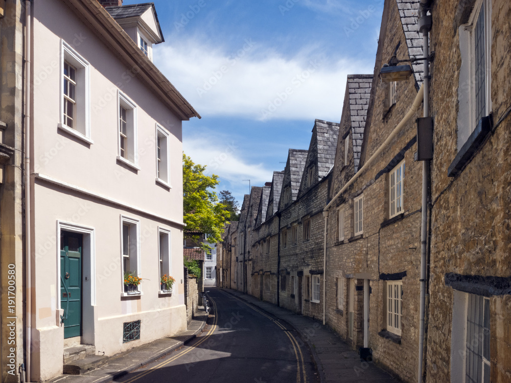 Quaint and historic buildings line the streets in the older parts of Cirencester, Gloucestershire, UK