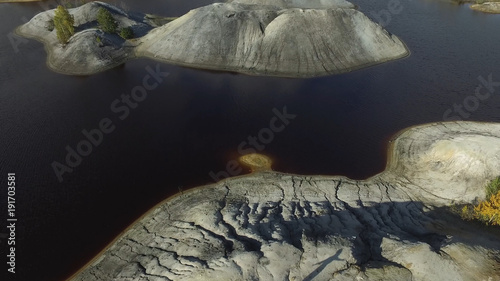 Aerial view on beautiful landscape with islands, rocks and lake background. Footage. Amazing nature landscape of lake with mountains and islands. Panoramic view of river