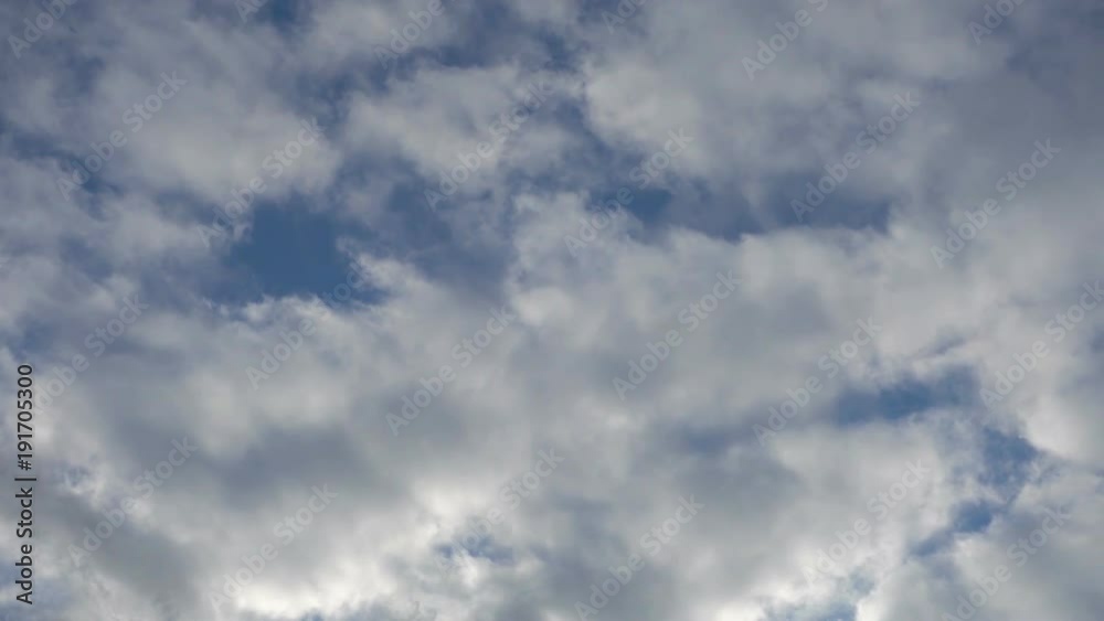 Real time flying grey clouds against blue sky. Real time flying grey clouds against blue sky.
