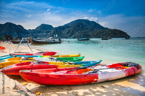 Colorful kayaks at Ao Loh Dalum beach on Phi Phi Don Island Krabi Province Thailand.