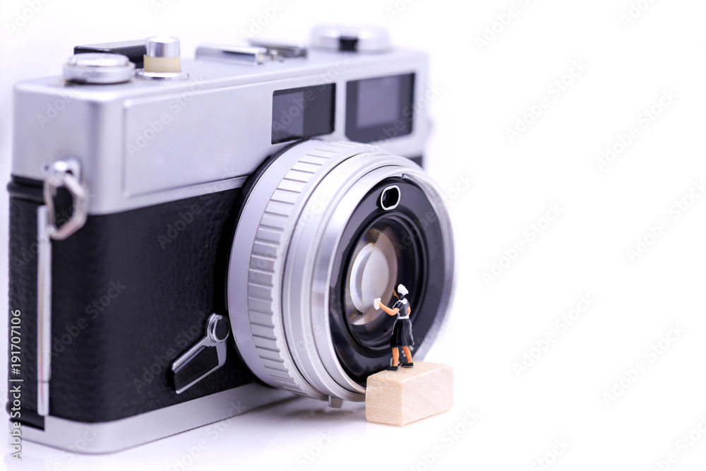 Miniature people : maid cleaning  a Retro, old, vintage and classic film camera