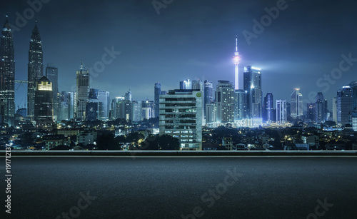 Photography Asphalt road side with beautiful Kuala Lumpur city skyline
