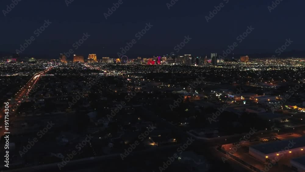 Aerial establishing shot of the bright Las Vegas city lights at night Aerial establishing shot of the bright Las Vegas city lights at night