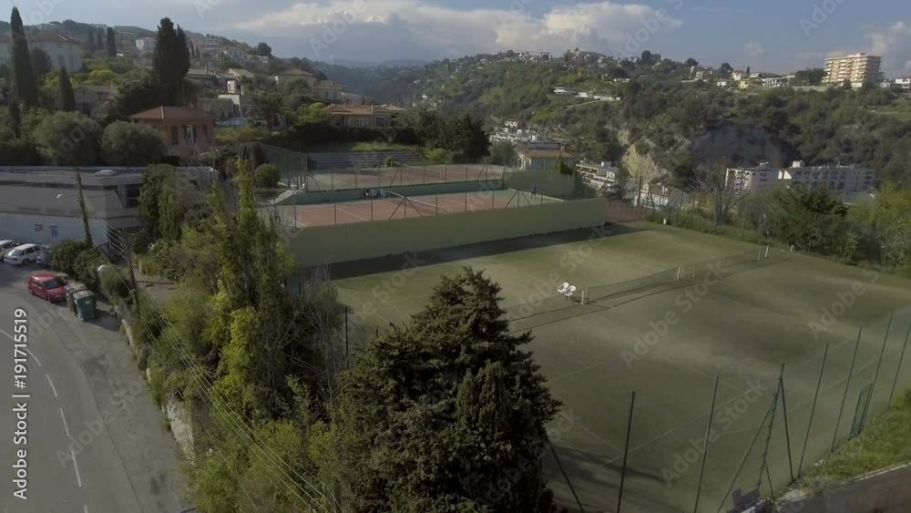 Beautiful aerial view of tennis court and summer cottage, relax on vacation Beautiful aerial view of tennis court and summer cottage, relax on vacation