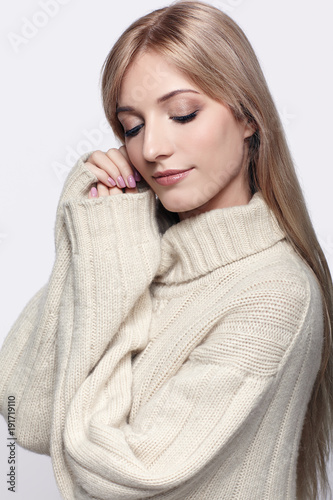 Blonde woman in cashmere sweater