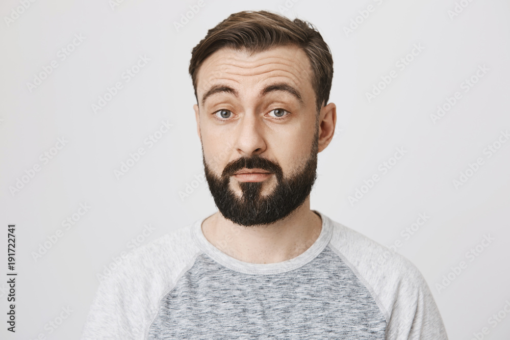 Adult man with a beard and moustache looking surprised over a white background. Person just found out that sister is going out with his best friend. He did not expect that coming. Adult man with a beard and moustache looking surprised over a white background. Person just found out that sister is going out with his best friend. He did not expect that coming.