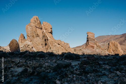 Obraz na płótnie Beautiful rocks with blue sky and a huge shadow on the front in the morning w salonie
