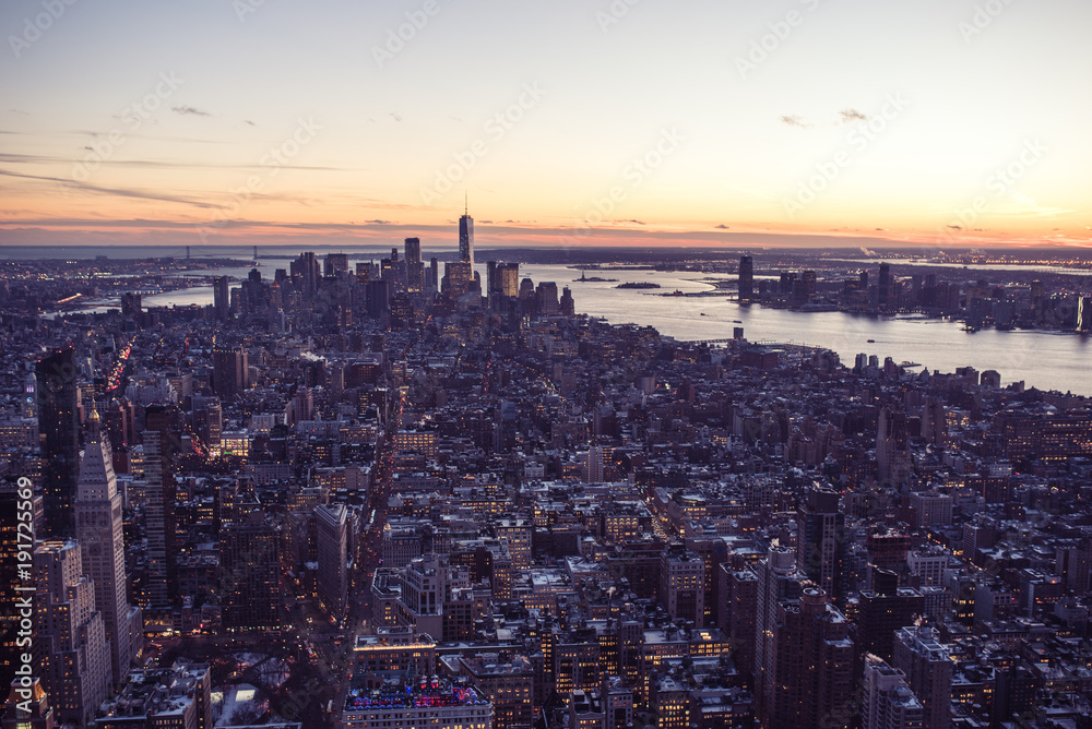 New York City - Manhattan downtown skyline skyscrapers at night - View from Observation Deck on the Empire State Building at twilight. USA. New York City - Manhattan downtown skyline skyscrapers at night - View from Observation Deck on the Empire State Building at twilight. USA.