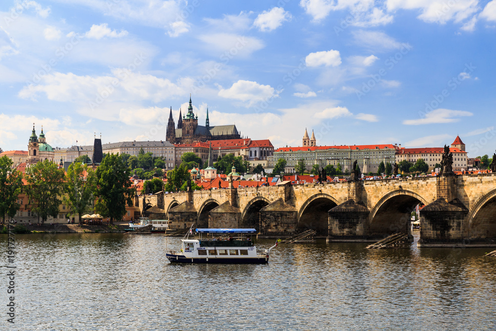 View of Charles Bridge and Castle of Prague on a sunny day