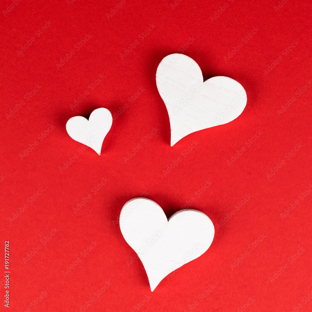 three white hearts on red background with copy space three white hearts on red background with copy space