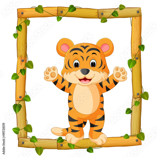 Fototapeta Naklejka Na Ścianę i Meble -  Tiger on the wood frame with roots and leaf