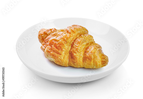 croissant in plate on white background