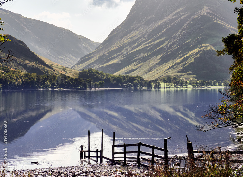 Views of Fleetwith Pike and Honister from the shore of Lake Buttermere in the English Lake District on a summers day, UK.