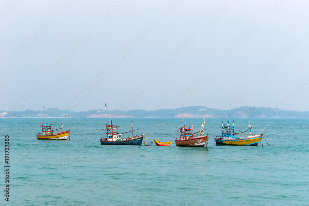 Traditional wooden fishing boats in the ocean. Southern Sri Lanka.