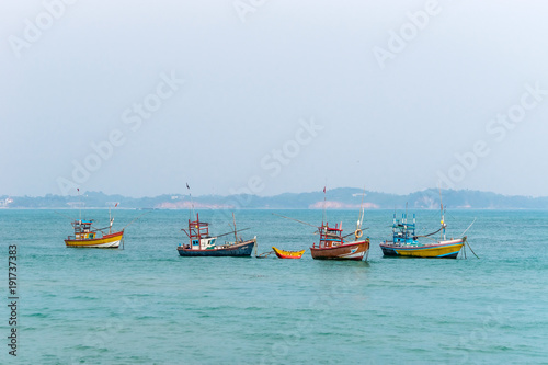 Traditional wooden fishing boats in the ocean. Southern Sri Lanka.