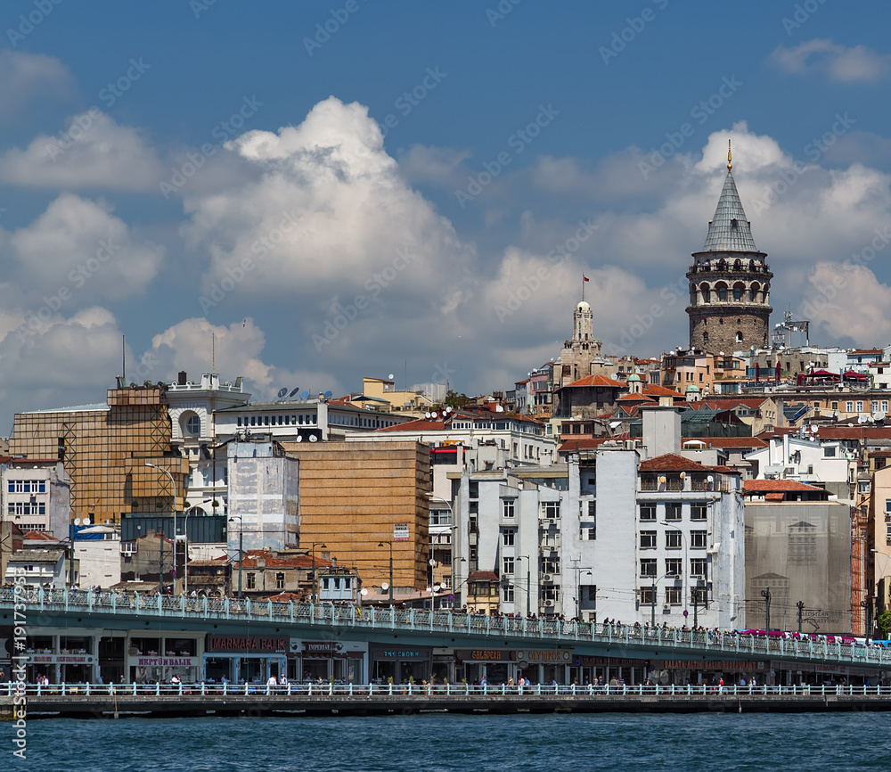 Cityscape summer sea front view with Galata Tower and Gulf of the Golden Horn in Istanbul, Turkey.