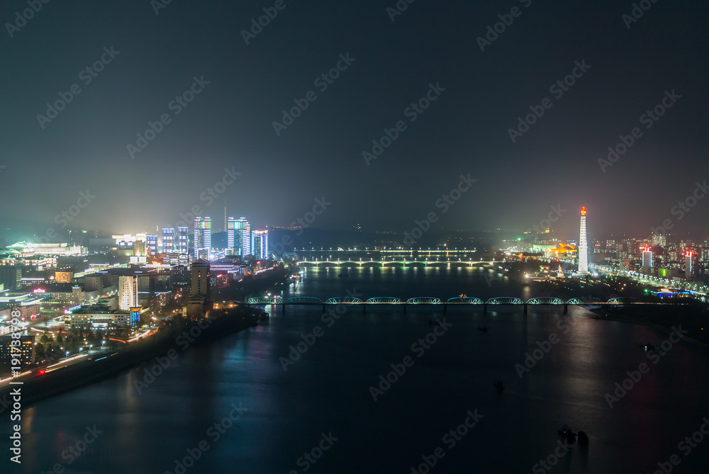 Pyongyang night skyline lights with taedong river