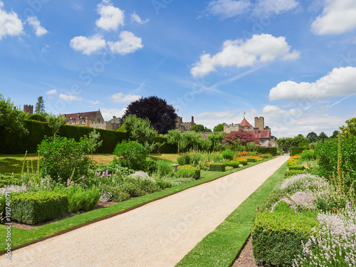 Flower gardens at the historic medieval grounds and buildings of Penhurst Place. © Duncan Andison