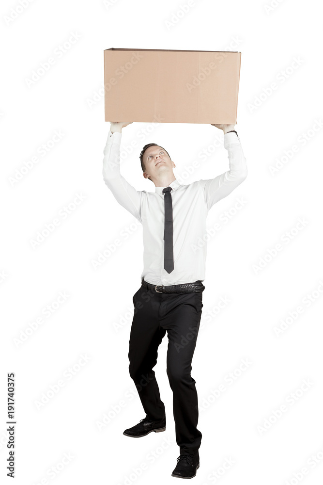 Caucasian businessman lifting a heavy box on studio Caucasian businessman lifting a heavy box on studio