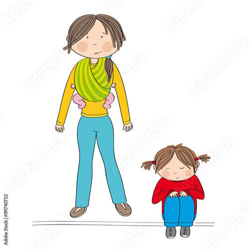 Sibling rivalry. Sad little girl sitting on the ground being sad. Her mother standing behind her carrying her sister, little baby girl, in baby sling. Mum doesn't know what to do.