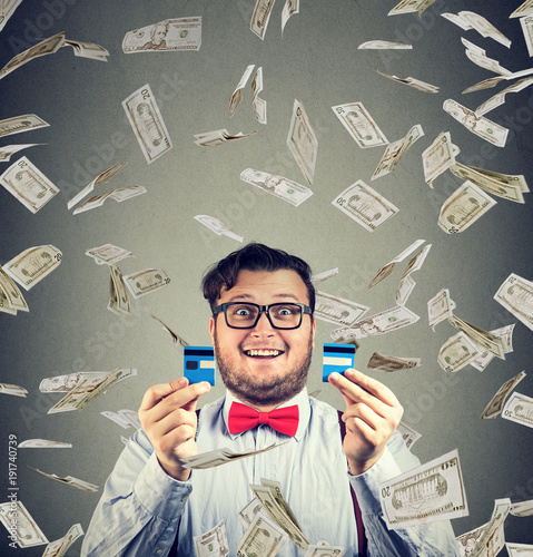 Cheerful man excited with money bonus